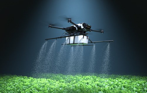 drone-spraying-fertilizer-vegetable-green-plants-agriculture-technology-farm-automation (1)